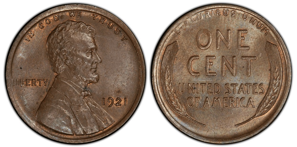 Grading strip showing four 1921 wheat pennies from Good through Uncirculated condition grades