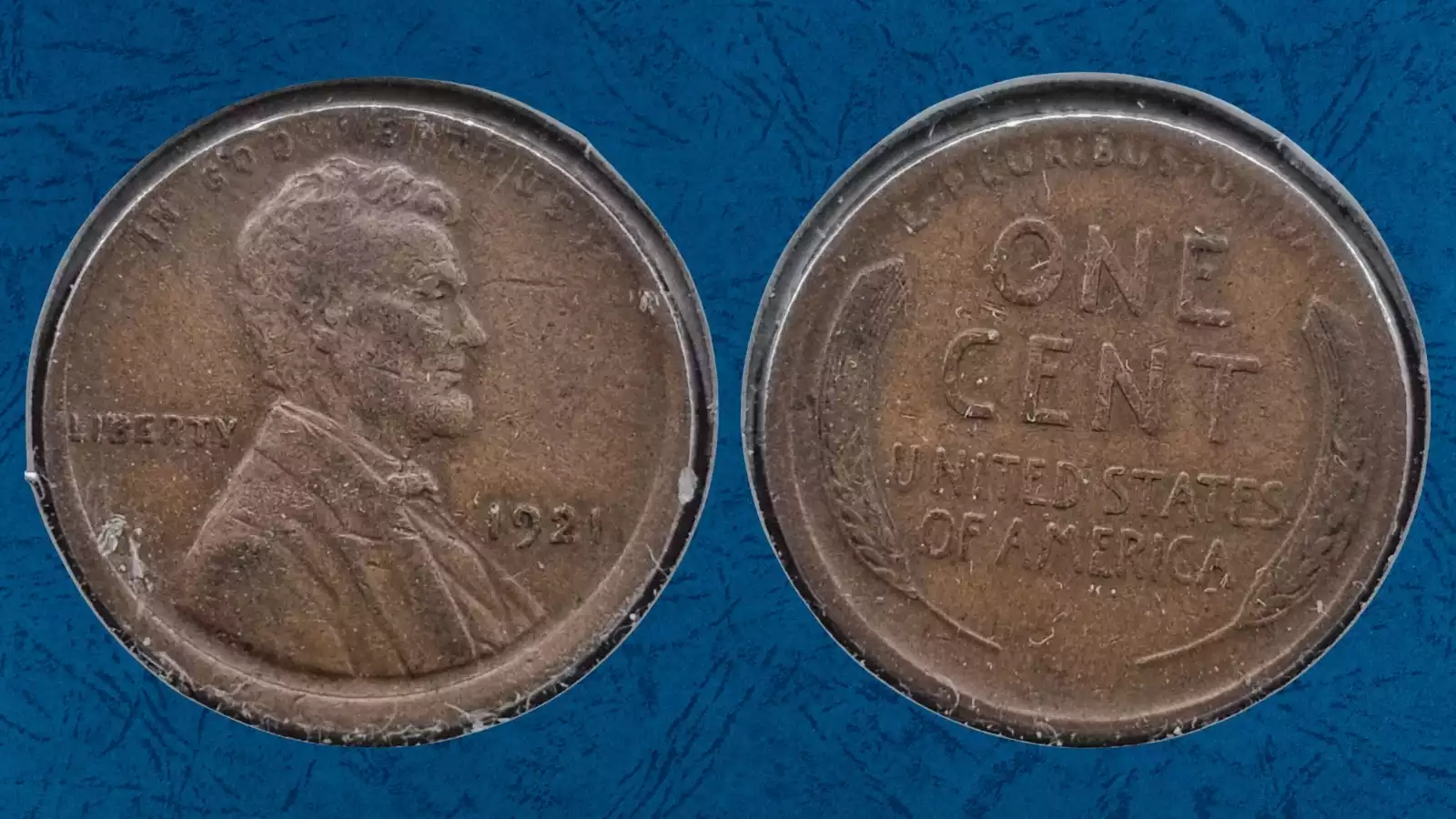 Comparison of normal 1921 wheat penny versus off-center strike error showing shifted Lincoln portrait and blank crescent area