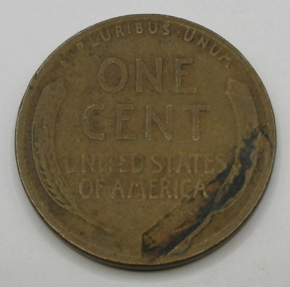 1921 wheat penny lamination error showing peeling or flaking surface layer near Lincoln portrait